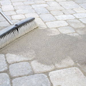 sweeping pavers